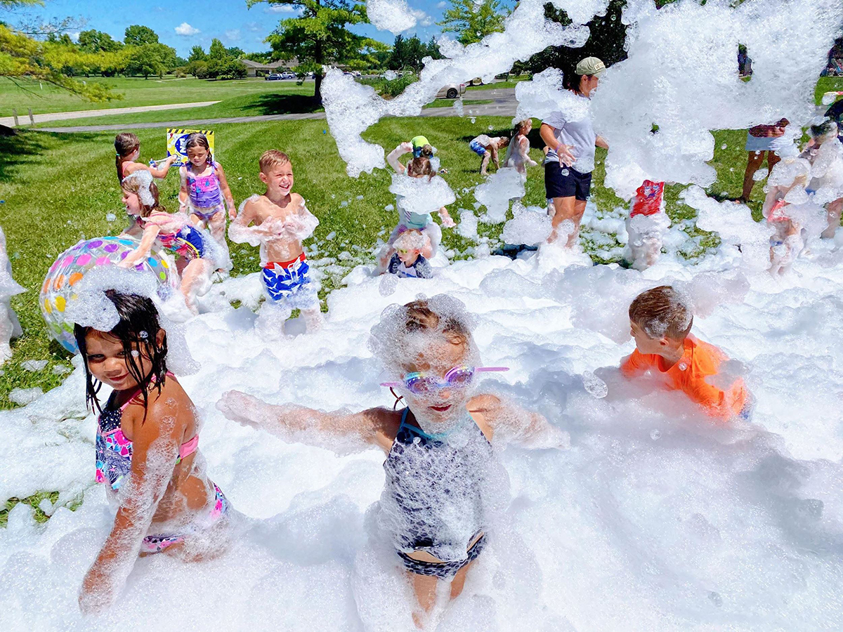 children playing in foam area (bubbles) during Tiny Tot Triathlon